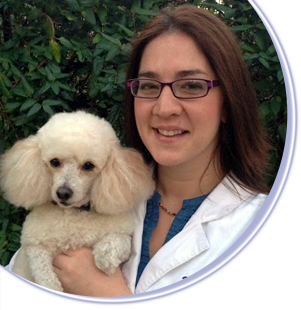 Photo of Dr. Megan Nunemacher, a staff veterinarian, and her dog